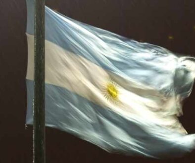 night view of buenos aires in the rain and the Argentine flag